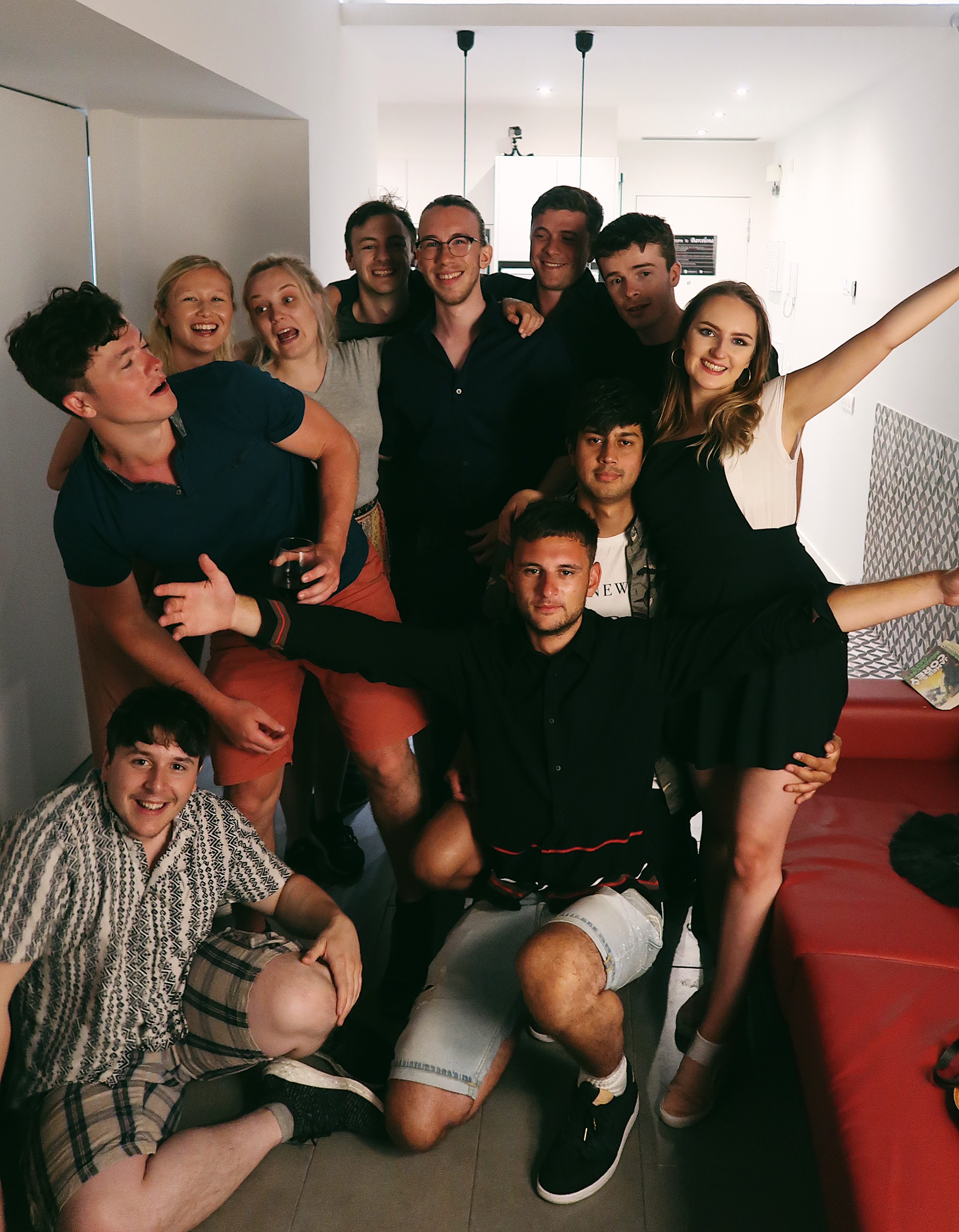 Friends smiling in apartment in Barcelona