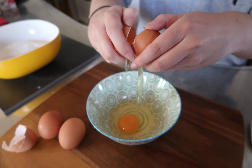 Cracking eggs for pancakes