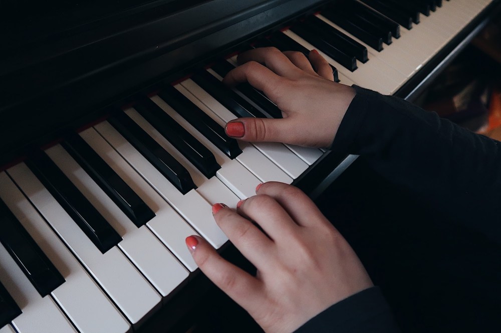 Hands playing piano
