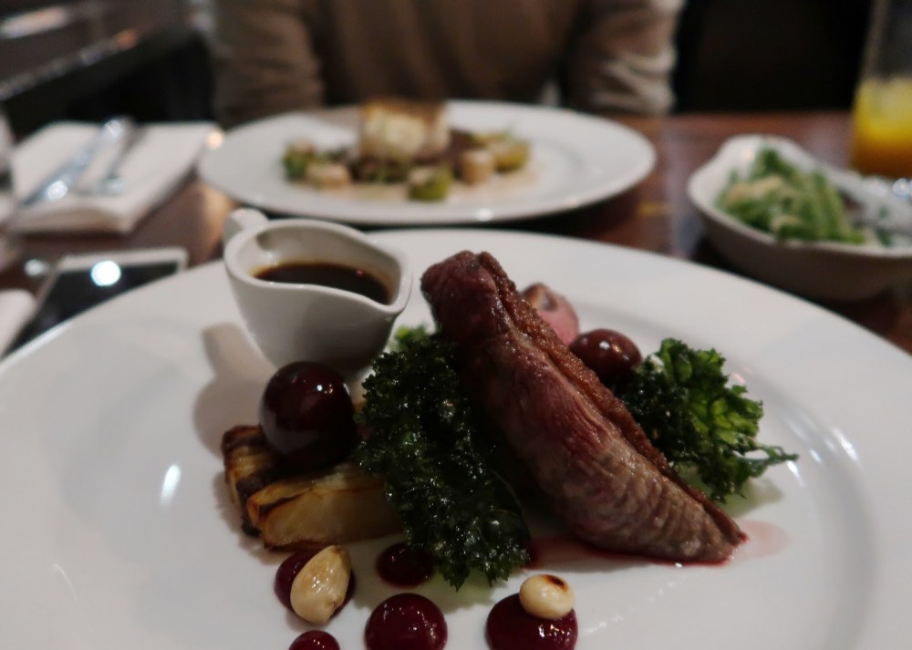 Duck breast, cherries, almonds and kale with jus